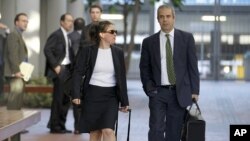Samsung lawyers Kevin Johnson and Victoria Maroulis leave court last month after a jury in San Jose, California, ordered the company to pay Apple $1 billion for patent violations