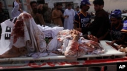 Pakistan volunteers rush an injured person to a hospital in Quetta, Pakistan, Aug. 16, 2019. 