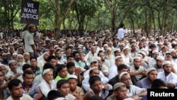 Rohingya refugees take part in a protest at the Kutupalong refugee camp to mark the one-year anniversary of their exodus from Myanmar, in Cox's Bazar, Bangladesh, Aug. 25, 2018.