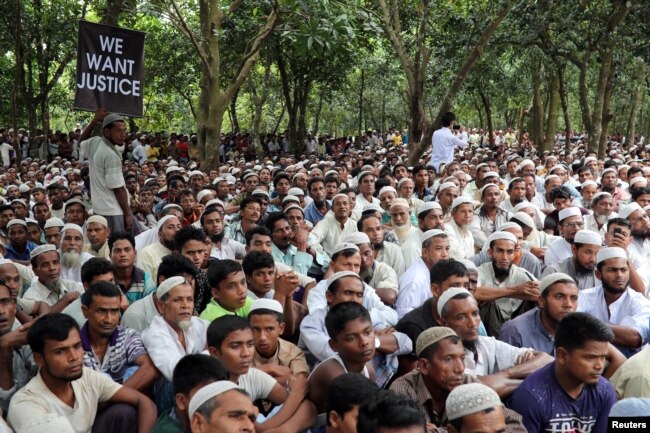 Rohingya refugees take part in a protest at the Kutupalong refugee camp to mark the one-year anniversary of their exodus from Myanmar, in Cox's Bazar, Bangladesh, Aug. 25, 2018.