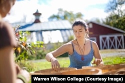 Warren Wilson College students working on the farm. They grow their own food on their school farm outside Asheville, North Carolina.