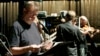 FILE - Garrison Keillor looks over the script during rehearsal for "A Prairie Home Companion" at the Fitzgerald Theater in St. Paul, Minn., April 13, 2007. (AP)