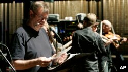 FILE - Garrison Keillor looks over the script during rehearsal for "A Prairie Home Companion" at the Fitzgerald Theater in St. Paul, Minn., April 13, 2007. (AP)