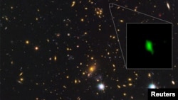 A galaxy located 13.28 billion light-years away is giving scientists new insight into the early history of the universe, with the detection of the oldest-known evidence of oxygen. Courtesy ALMA (ESO/NAOJ/NRAO), NASA/ESA Hubble Space Telescope, W. Zheng (JHU), M. Postman (STScI), the CLASH Team, Hashimoto et al/Handout