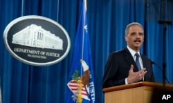 FILE - Attorney General Eric Holder speaks at the Justice Department in Washington, March 4, 2015.