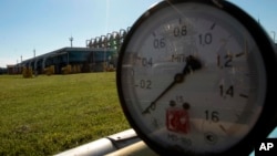 FILE - This Wednesday May 21, 2014 file photo shows a gas pressure gauge in Bil 'che-Volicko-Ugerske underground gas storage facilities in Strij, outside Lviv, Ukraine. Russia on Monday, June 16, 2014