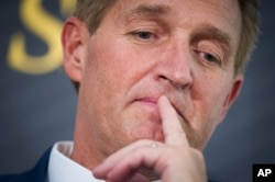 FILE - In this Oct. 2, 2018 file photo Sen. Jeff Flake, R-Ariz. participates in an interview at the The Atlantic's 'The Constitution in Crisis' forum in Washington.