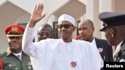 FILE - Nigeria President Muhammadu Buhari waves after a meeting in Abuja, Nigeria, Jan. 9, 2017. He has been in Britain since January 19 on medical leave.