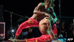 Members of Tinafan, an Guinean circus performing group, perform during the second edition of the African Circus Arts Festival in Addis Ababa, on March 2, 2018. 