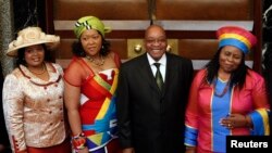 South African President Jacob Zuma poses for photographs with three of his wives in Cape Town, June 3, 2009.