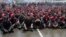 Hundreds of demonstrators block the road outside the parliament building, while parliament members hold a meeting to pass the mass organization bill, in Jakarta, July 2, 2013.
