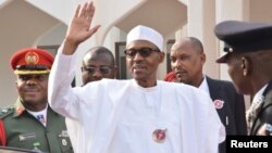 Nigeria President Muhammadu Buhari, waves after a meeting in Abuja, Nigeria, Jan. 9, 2017. Buhari will travel with three West African heads of state to Gambia in an effort to persuade its longtime leader Yahya Jammeh to step down.