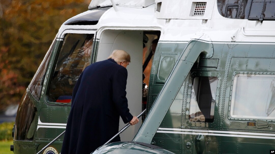 FILE - President Donald Trump boards Marine One on the South Lawn of the White House in Washington, Nov. 26, 2019, for a short trip to Andrews Air Force Base in nearby Maryland.