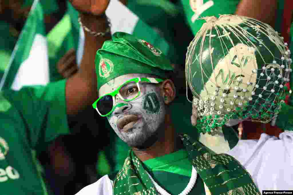 A Nigeria supporter cheers prior to the football match between Guinea-Bissau and Nigeria in Cameroon on Jan. 19, 2022.
