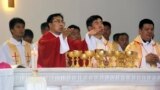 In this photo released by Henan Catholic, Rev. Joseph Zhang Yinlin, second left, takes part in an ordination ceremony to be named coadjutor bishop of Anyang, in Anyang city in central China's Henan province, Aug. 4, 2015.