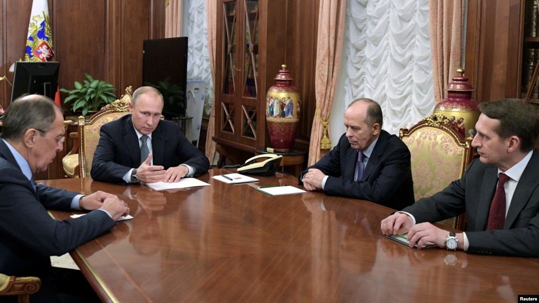 Russia's President Vladimir Putin, second from left, Foreign Minister Sergei Lavrov, left, Director of Russian Federal Security Service Alexander Bortnikov, second from right, and Director of Foreign Intelligence Service Sergei Naryshkin hold a meeting at the Kremlin in Moscow, Dec. 19, 2016. 