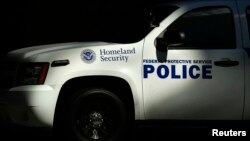 FILE - A Homeland Security vehicle is parked outside a federal government building in San Diego, California, September 24, 2013.