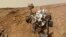 NASA's Mars rover Curiosity is pictured in this February 3, 2013 handout self-portrait obtained by Reuters February 9, 2013. The image was made by combining dozens of exposures taken by the rover's Mars Hand Lens Imager (MAHLI). The rover is positioned at