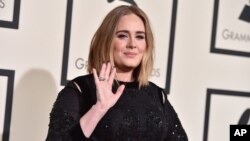 FILE - Adele arrives at the 58th annual Grammy Awards at the Staples Center on Feb. 15, 2016, in Los Angeles. 