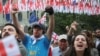 (FILE) Demonstrators hold a rally to protest against a bill on "foreign agents", after Georgia's parliament voted to override a presidential veto of the bill, in Tbilisi, Georgia, May 28, 2024.