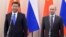 FILE - Russia's President Vladimir Putin (R) is seen with his Chinese counterpart Xi Jinping in Sochi, Russia, February 6, 2014.