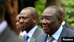 FILE - Central African Republic's President Michel Djotodia (R) arrives for the Heads of States and Governments International Conference on the Great Lakes Region in Nairobi on July 31, 2013. 