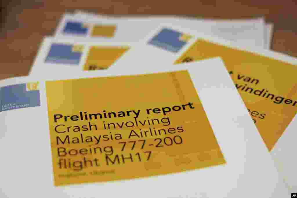 A stack of preliminary reports by the Dutch Safety Board on the crash of Malaysia Airlines flight MH17 is displayed at the board's headquarters in The Hague, Netherlands, Sept. 9, 2014.