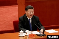 资料照片： 中国国家主席习近平在北京人民大会堂举行的“纪念辛亥革命110周年大会”上发表讲话。(2021年10月9日)