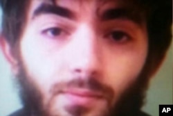 This undated photo made available to the Associated Press on condition that its source not be revealed, allegedly shows Khamzat Azimov, the suspect in the Paris knife attack.
