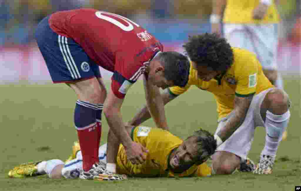 Brazil's Neymar screams out after being fouled during the World Cup quarterfinal soccer match between Brazil and Colombia at the Arena Castelao in Fortaleza, Brazil, Friday, July 4, 2014. Brazil's team doctor says Neymar will miss the rest of the World Cu