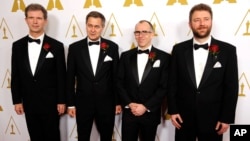 Left to right, Jan Sperling, Emmanuel Prevenaire, Etienne Brandt and Tony Postiau, developers of the Flying-Cam SARAH 3.0 system and recipients of a Scientific and Engineering Award, pose together at the Academy of Motion Picture Arts and Sciences' annual Scientific and Technical Awards on Saturday, Feb. 15, 2014, in Beverly Hills, California.