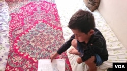 Fazel Ahmed, 9, lost his arm in a mortar attack in Afghanistan, but his family did not flee until the Taliban took over his region this summer on April 13, 2021 in Van, Turkey. (Heather Murdock/VOA)