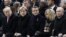 FILE - From left, President Donald Trump, German Chancellor Angela Merkel, French President Emmanuel Macron and his wife Brigitte Macron, and Russian President Vladimir Putin attend an Armistice Day ceremony in Paris, France, Nov. 11, 2018.