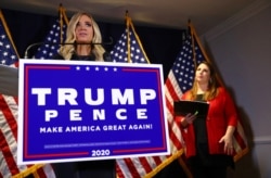FILE - White House press pecretary Kayleigh McEnany discusses Trump campaign plans to pursue legal challenges to the 2020 presidential election results, as RNC Chairwoman Ronna McDaniel listens, during a news conference in Washington, Nov. 9, 2020.