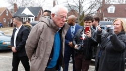 Democratic presidential candidate Sen. Bernie Sanders, I-Vt., visits outside a polling location at Bow Elementary in Detroit, March 10, 2020.