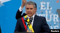 Ivan Duque memberikan pidato usai dilantik sebagai Presiden baru Kolombia dalam upacara di Lapangan Bolivar, Bogota hari Selasa (7/8). 