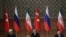 TURKEY -- Turkish President Recep Tayyip Erdogan (C), Russian President Vladimir Putin (R) and Iranian President Hassan Rohani attend a press conference after their meeting at the Presidential Palace in Ankara, April 4, 2018