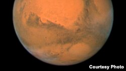 Foto Mars yang diambil Teleskop Antariksa Hubble Space Telescope dari jarak 88 juta kilometer. (NASA)