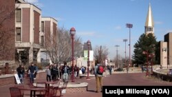 Students walk across campus at the University of Denver in Denver, Colorado.