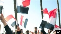 Egyptian anti-Mubarak protesters shout slogans as they march in Alexandria, Egypt, Feb 8, 2011