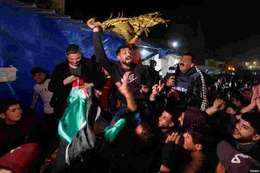 Palestinians react to news on a ceasefire deal with Israel, in Khan Younis in the southern Gaza Strip.