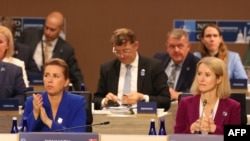 Denmark's Prime Minister Mette Frederiksen and Estonia's Prime Minister Kaja Kallas attend the NATO 75th anniversary summit at the Walter E. Washington Convention Center in Washington, DC, on July 10, 2024. (Photo by SAMUEL CORUM / AFP)