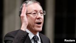 FILE - Liberal MP Irwin Cotler speaks in the House of Commons on Parliament Hill in Ottawa, Dec. 15, 2011. 