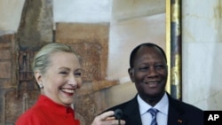 U.S. Secretary of State Hillary Clinton and Ivory Coast President Alassane Dramane Ouattara hold a joint news conference at the Presidency in Abidjan, Ivory Coast, January 17, 2012.