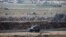 Palestinian demonstrators protest at the Israel Gaza border, Aug. 17, 2018. 