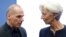 Greek Finance Minister Yanis Varoufakis talks to International Monetary Fund (IMF) Managing Director Christine Lagarde (R) during a euro zone finance ministers meeting in Luxembourg, June 18, 2015. 