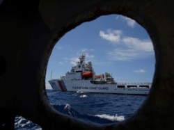 FILE - A Chinese Coast Guard ship is seen in the South China Sea, March 29, 2014.