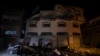 Palestinians check the damage of a house targeted by Israeli missile strikes in Gaza City, Nov. 12, 2019. 