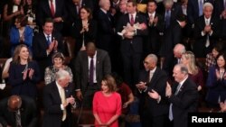 House Democratic leader Nancy Pelosi (D-CA) is applauded by U.S. Rep. Steny Hoyer (D-MD) and other members as she is nominated for House Speaker as the U.S. House of Representatives meets for the start of the 116th Congress on Capitol Hill in Washington, 