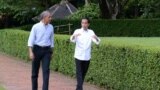 Prezida Joko Widodo dan mantan wa Indoneziya (i buryo), na Barack Obama, yahoze ari Prezida wa Amerika (i bubamfu).